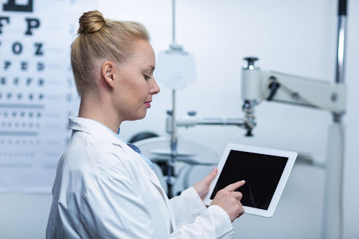 optometrist using a tablet