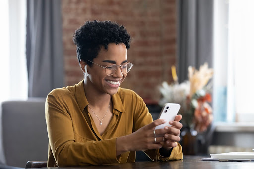 smiling woman using her phone
