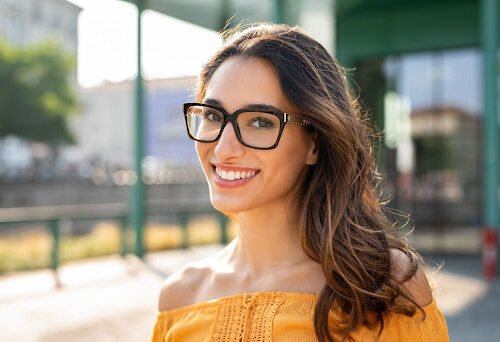 smiling woman wearing glasses