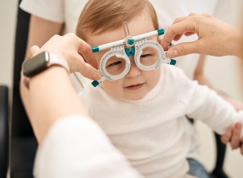 child being measured for glasses